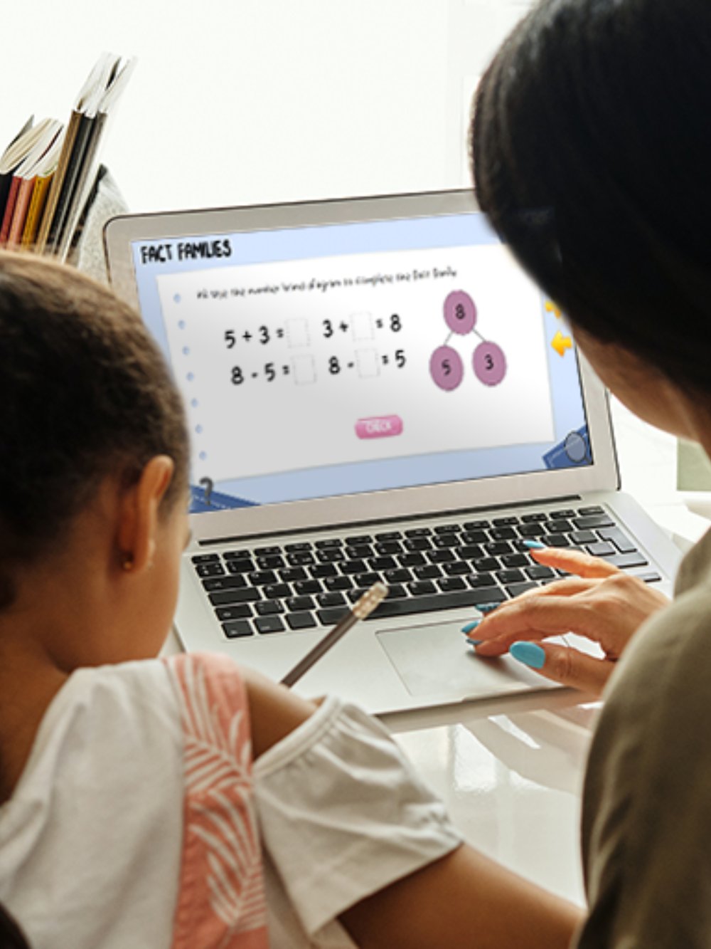 A mother and daughter working together on maths activities with the Everybody Counts Fact Families lesson